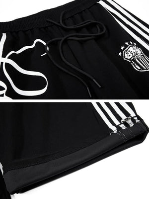 Gestreifte Jogginghose – Schwarz, Nahaufnahme Badge und Saum | XoKool