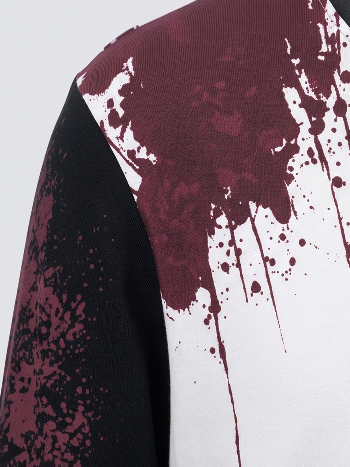 Studded flag long sleeve tee – red splatter shoulder close-up | XoKool