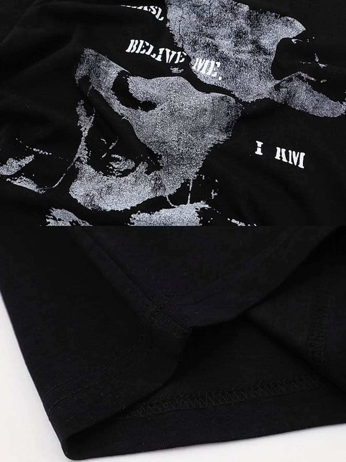 Torn face graphic tee – print and hem close-up | XoKool