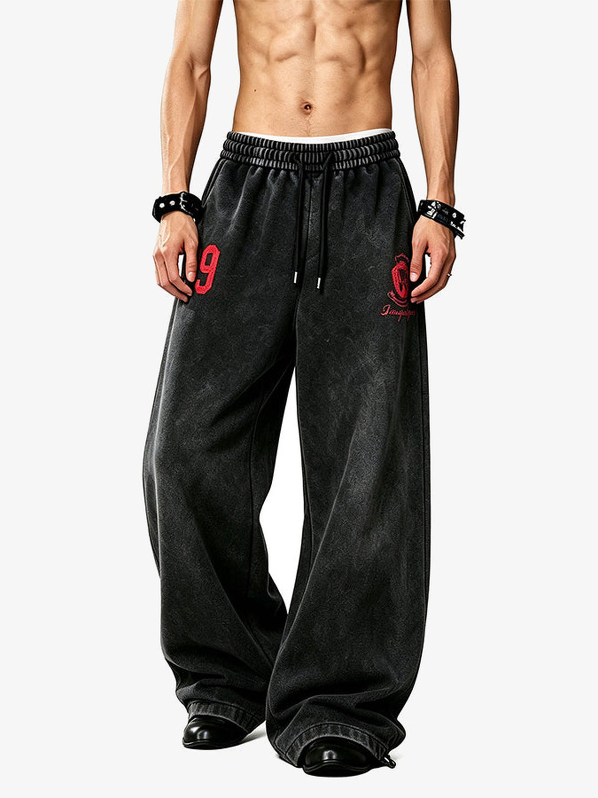 Number print sweatpants – Black, on model front | XoKool