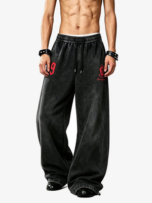 Number print sweatpants – Black, on model front | XoKool