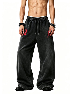 Washed Barrel Leg Sweatpants with Number Print – Black, on model front | XoKool