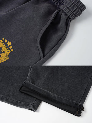 Number print sweatpants – Gold crest and hem close-up | XoKool