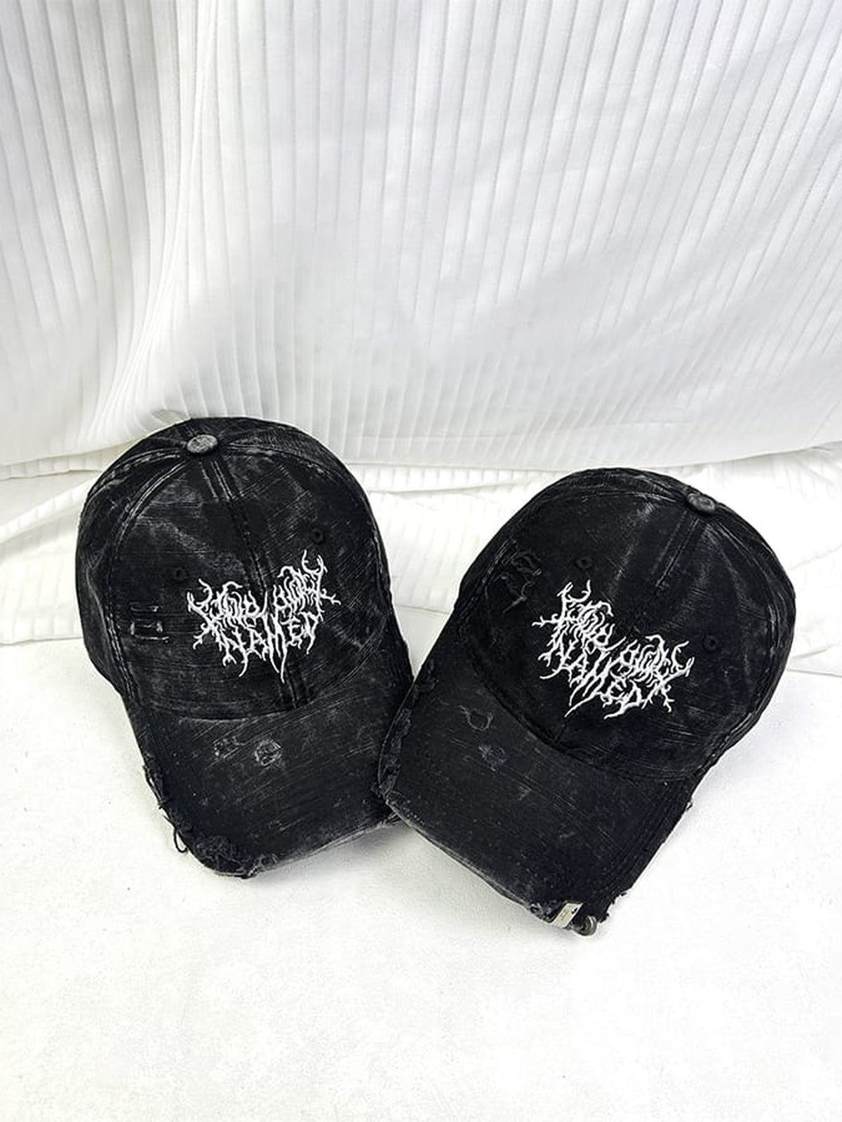 Washed Black Distressed Cap with Gothic Embroidery – two caps, front view | XoKool