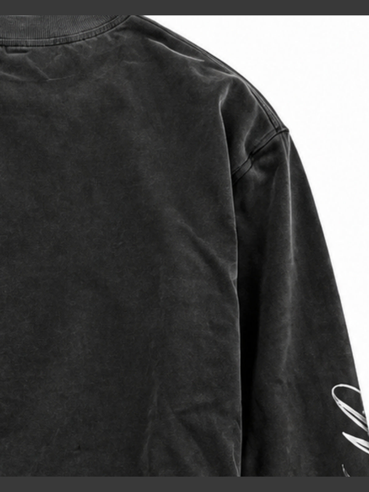 Washed Black Grillz Graphic Long Sleeve Tee – shoulder / sleeve script close-up | XoKool