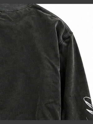 Washed Black Grillz Graphic Long Sleeve Tee – shoulder / sleeve script close-up | XoKool