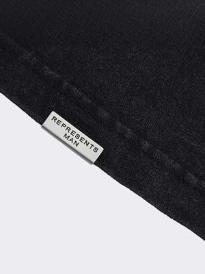 Washed Black Oversized Tee with Collage Back Print – hem close-up | XoKool