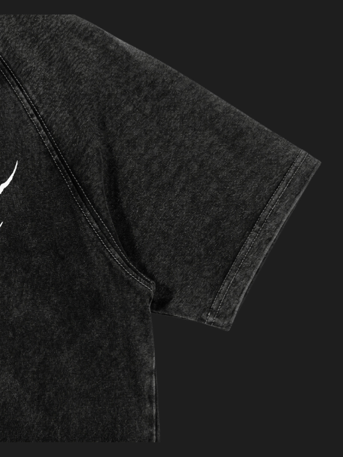 Washed Black Raglan Tee with Spiky Metal Lettering – sleeve close-up | XoKool