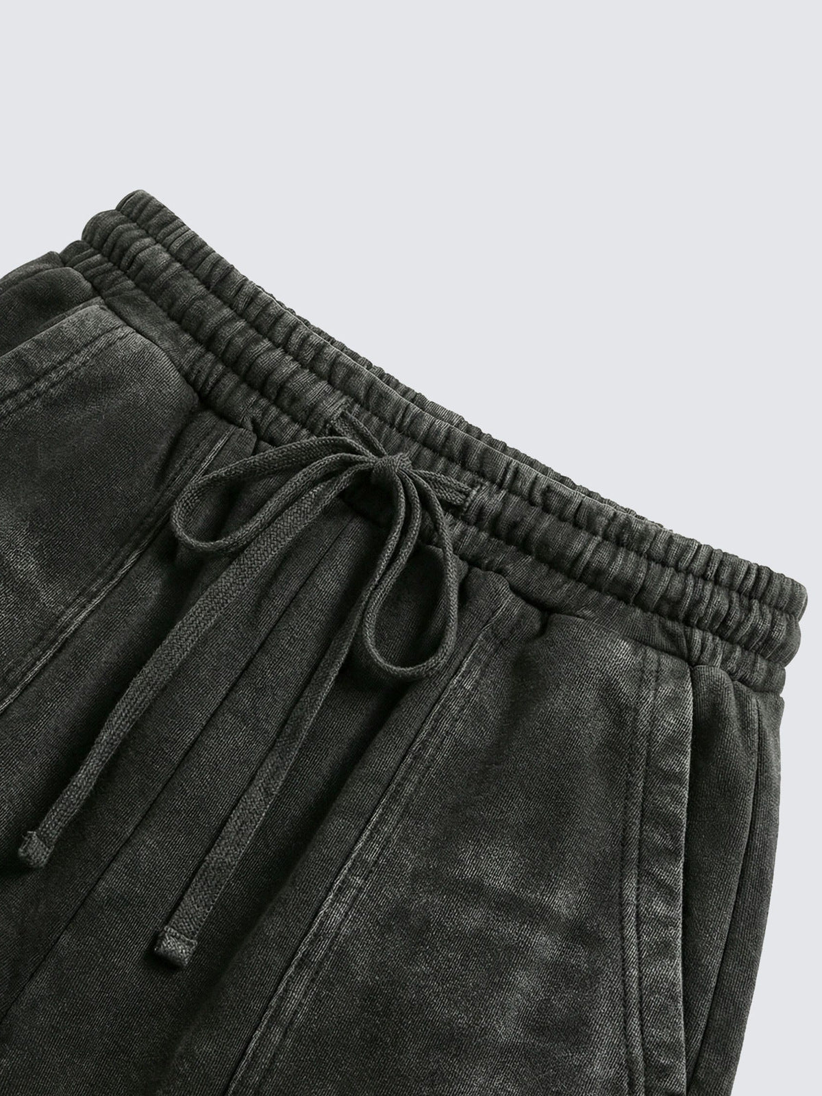 Pantalones deportivos con cremallera en el bajo – primer plano de la cintura y el cordón | XoKool