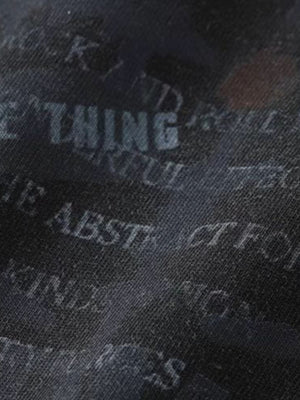 Shredded sleeve layered tee – text close-up | XoKool