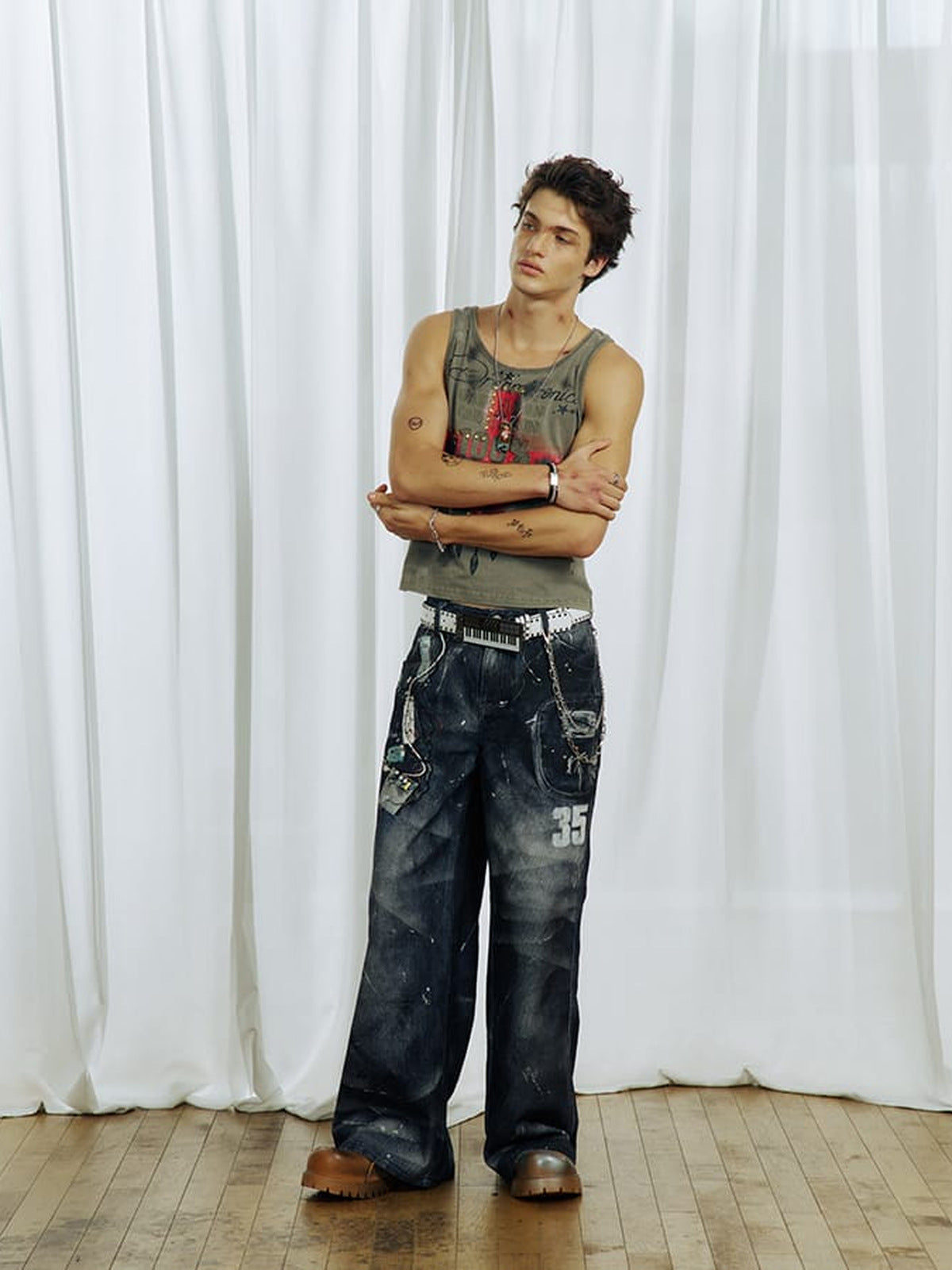 Graphic tank top – on male model, arms crossed | XoKool