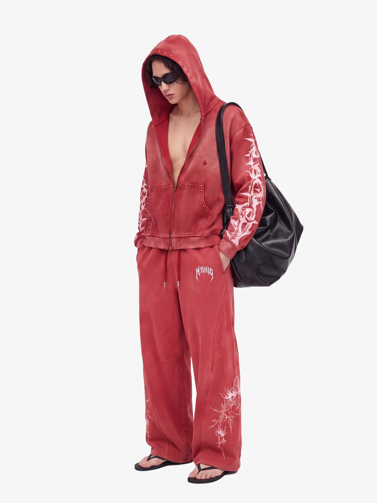 Thorn zip up hoodie – Red, on model with matching pants | XoKool