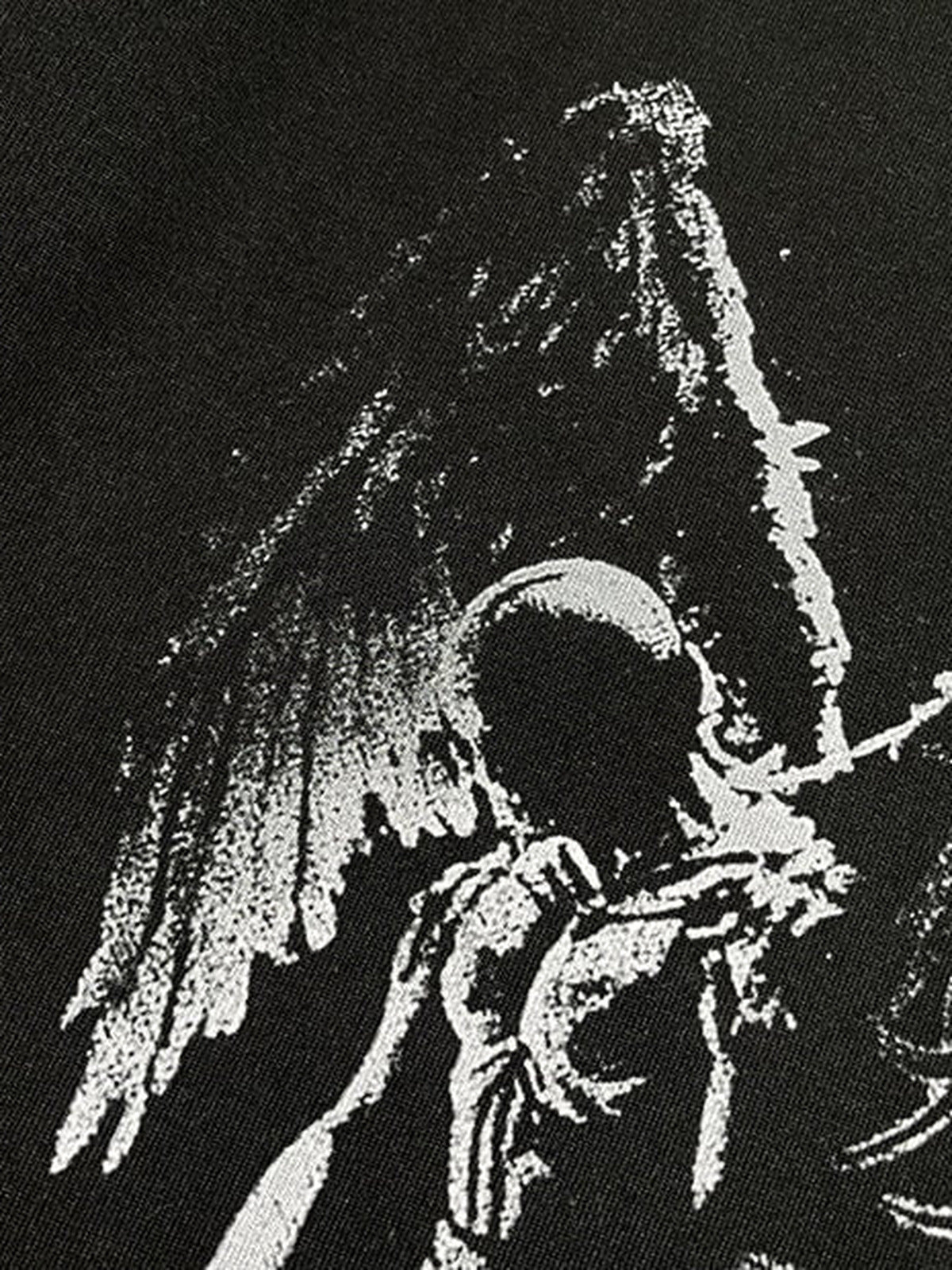 Winged skeleton layered tee – graphic detail close-up | XoKool