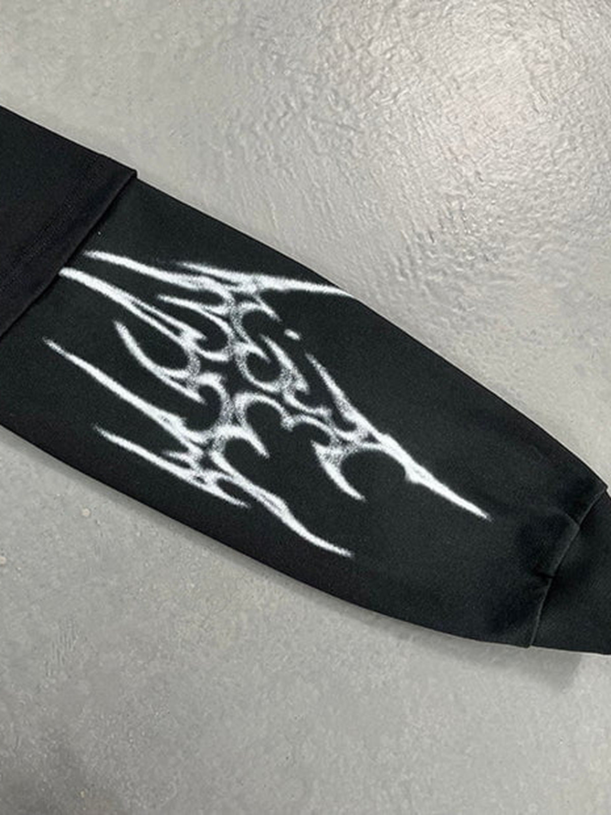 Winged skeleton layered tee – sleeve cuff close-up | XoKool