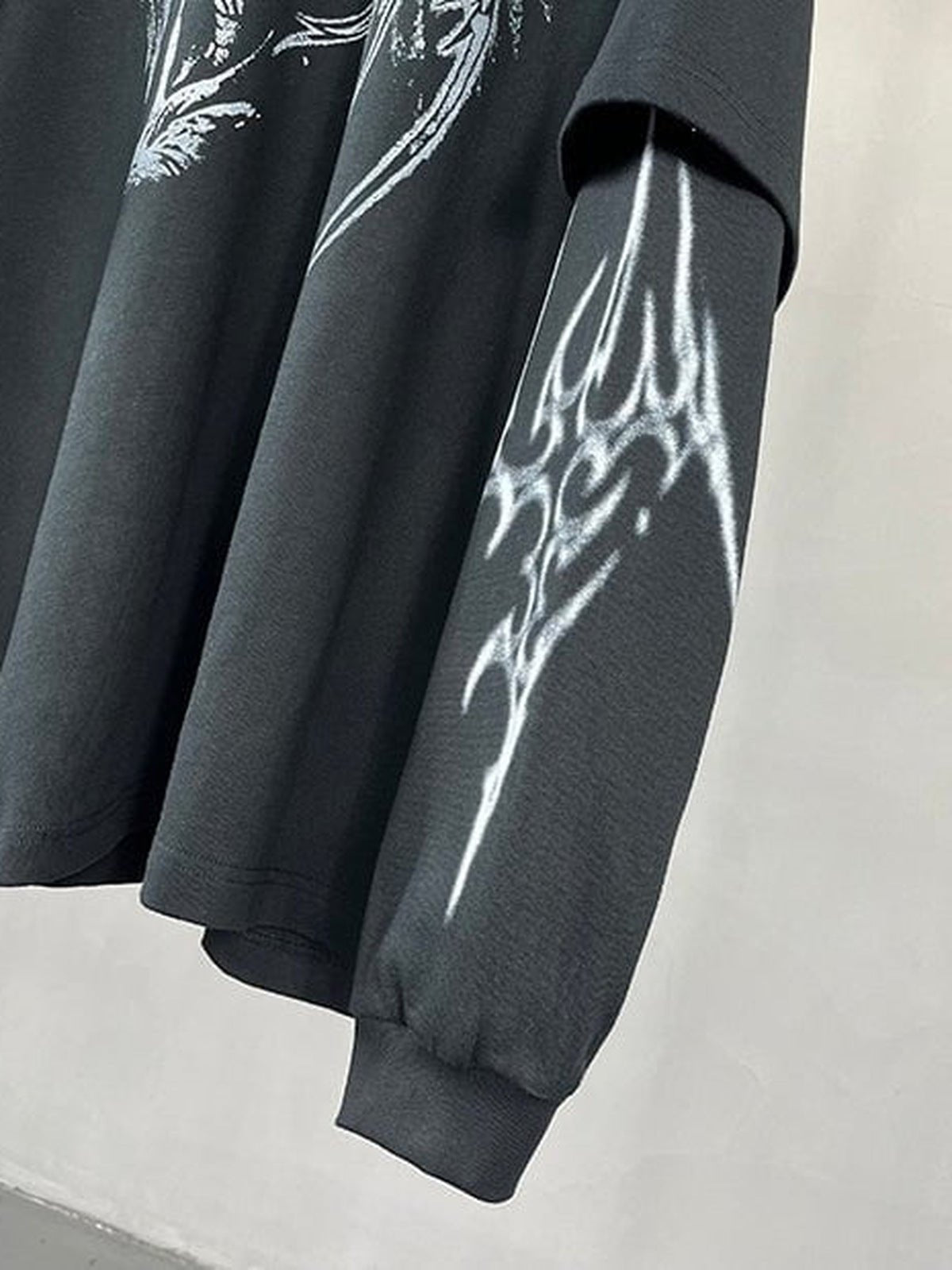 Winged skeleton layered tee – sleeve graphic close-up | XoKool