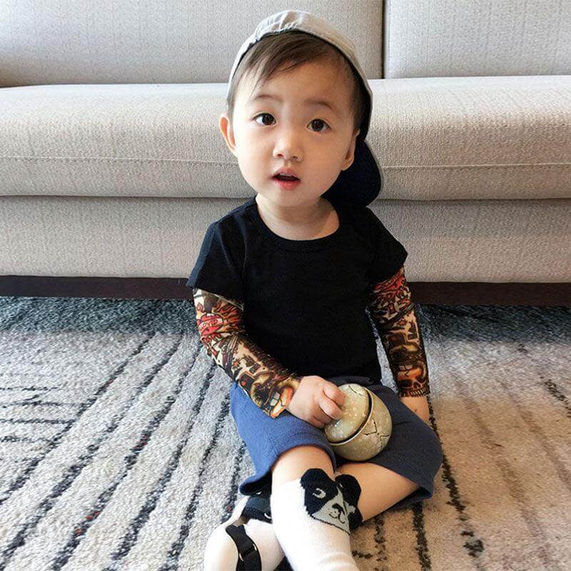 It’s not every day you see a toddler or kid sporting some awesome tats. Dress your cool kid in this shirt and it will be sure to turn heads! It comes with printed tattoos on each sleeve 👦 ☑️ This incredibly unique, unisex outfit is perfect for any occasi